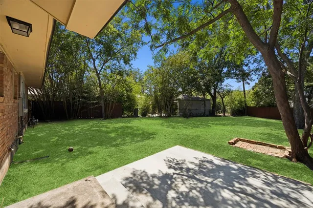 a view of a backyard with a garden