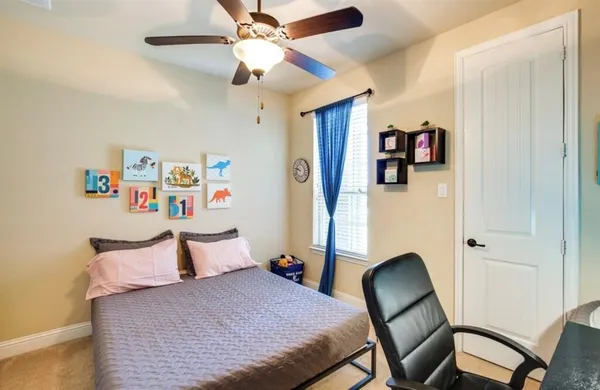 a bedroom with furniture and a bed