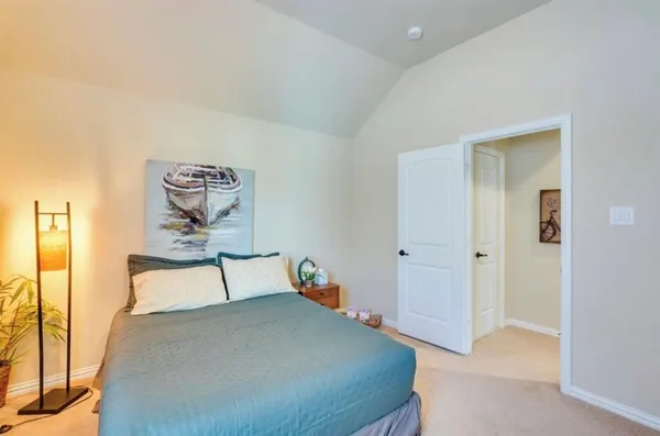 a bedroom with a bed and a table in it