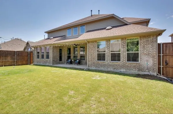 a front view of a house with a swimming pool
