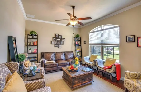 a living room with furniture and a large window