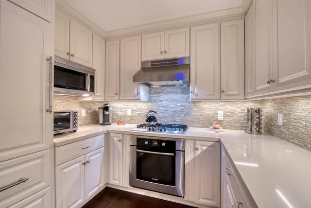 a kitchen with sink and cabinets