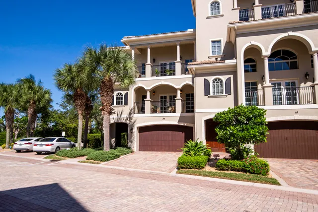 an aerial view of residential houses and lake