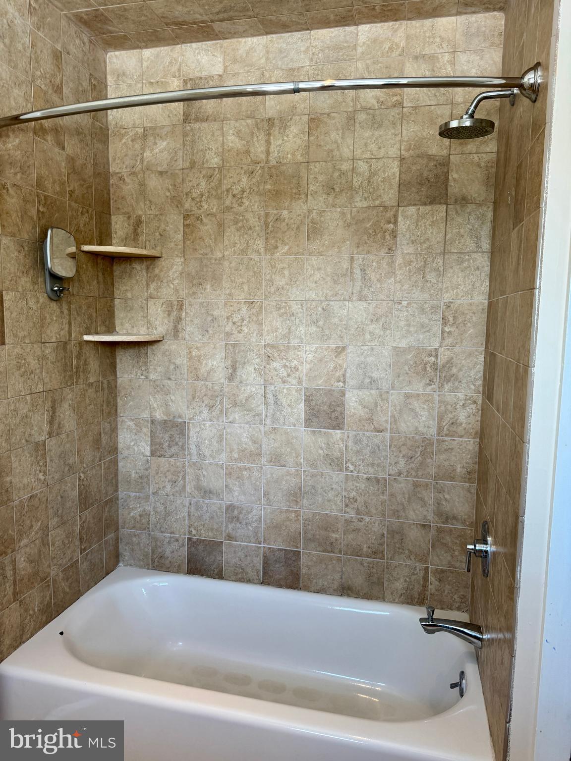 8233 Fairview Road Elkins Park, PA 19027 - Photo 15 of 36 a bathroom with a bathtub and a shower