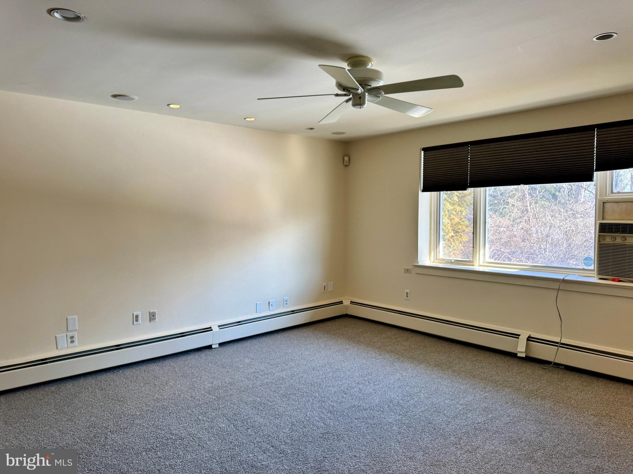 8233 Fairview Road Elkins Park, PA 19027 - Photo 18 of 36 an empty room with windows and fan