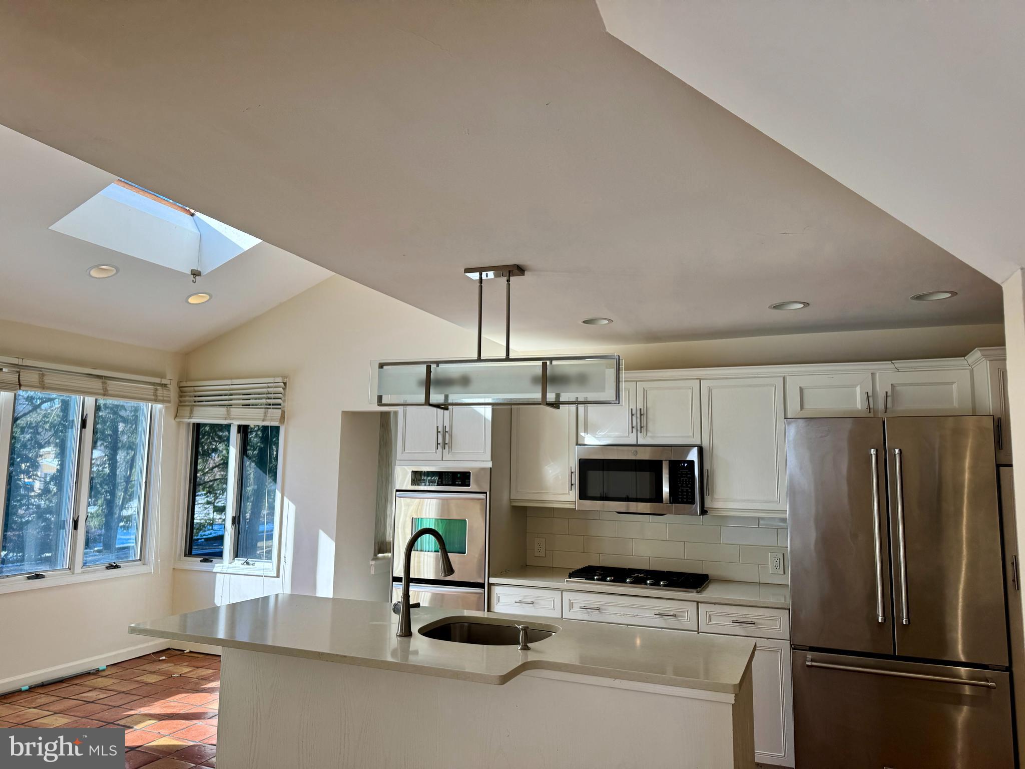 8233 Fairview Road Elkins Park, PA 19027 - Photo 2 of 36 a kitchen with stainless steel appliances a refrigerator sink and microwave