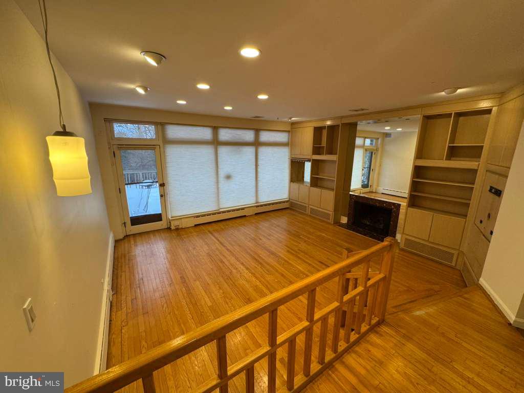 8233 Fairview Road Elkins Park, PA 19027 - Photo 5 of 36 a view of an empty room with wooden floor