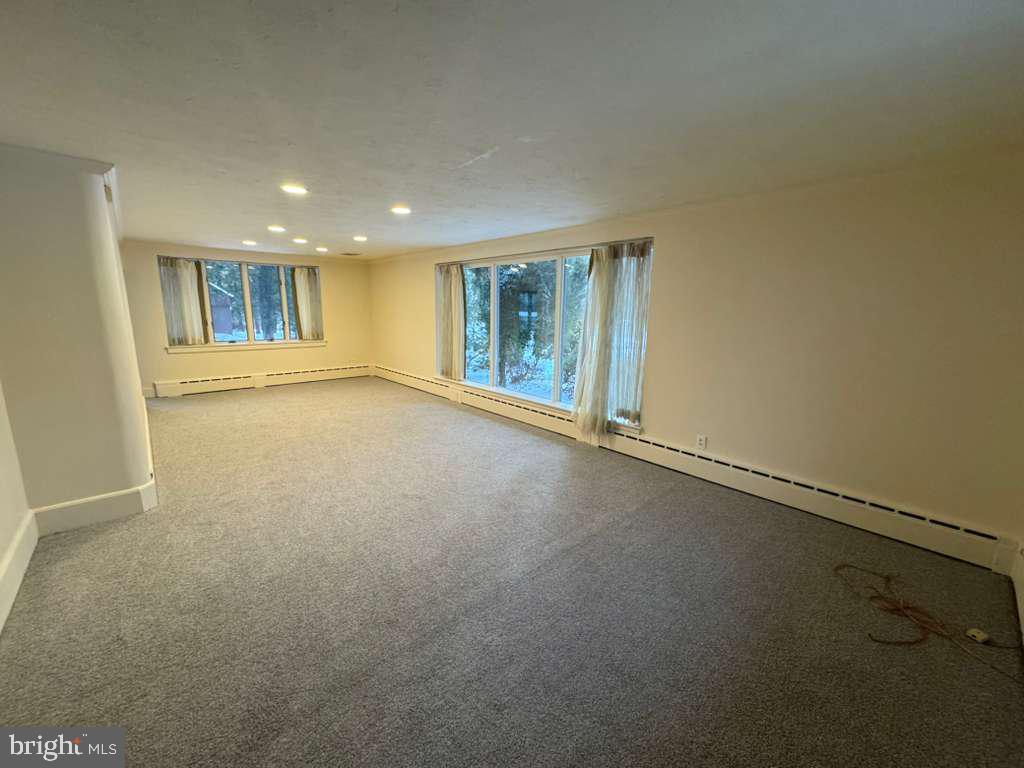 8233 Fairview Road Elkins Park, PA 19027 - Photo 9 of 36 an empty room with a empty space and windows