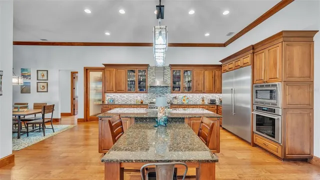 a kitchen with a counter space cabinets and appliances