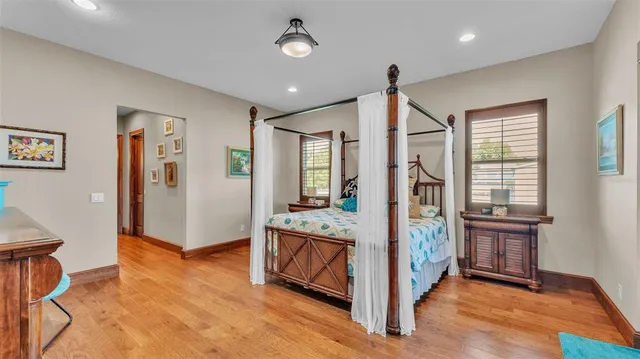 a view of a dining room with furniture a chandelier and wooden floor