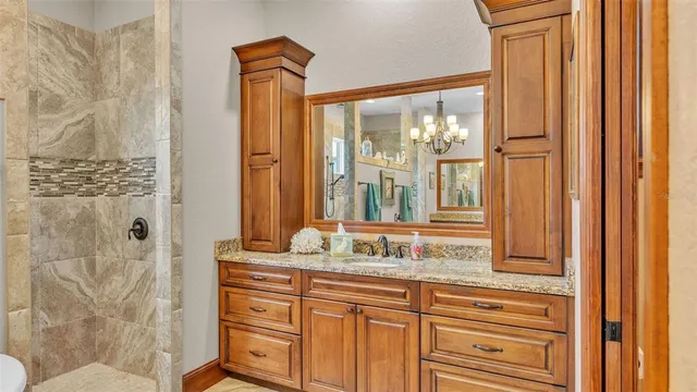 a view of a livingroom with a chandelier windows and entryway