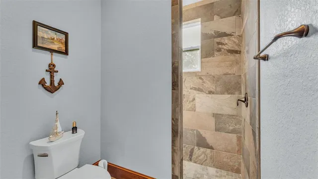 a view of a livingroom with furniture window and wooden floor