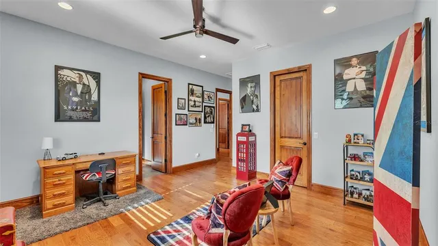 a aerial view of a house with a yard and lake view