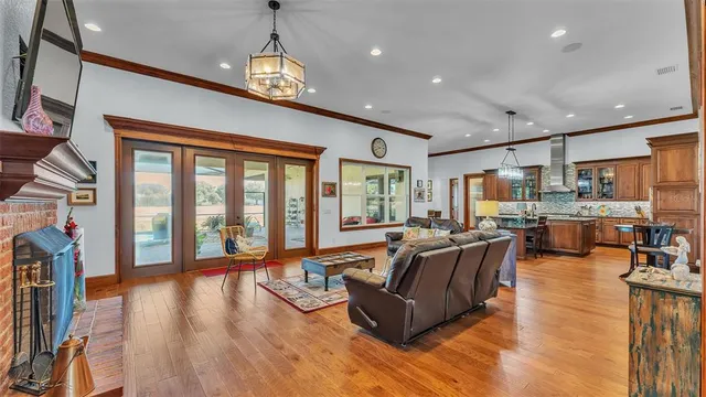 a living room with furniture fireplace and flat screen tv