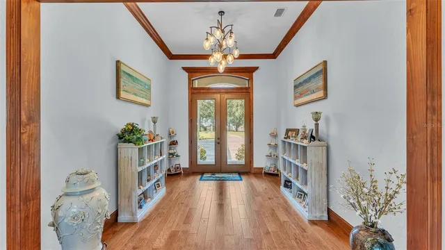 a kitchen with stainless steel appliances kitchen island granite countertop a table and chairs in it