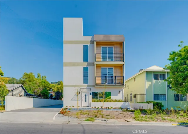 a front view of a building with street view