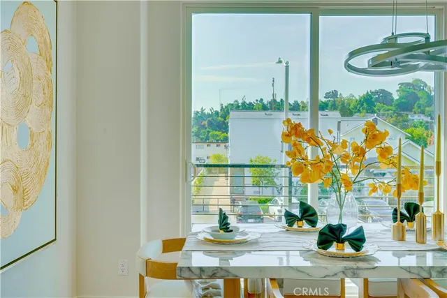 a view of a dining room with furniture window and outside view