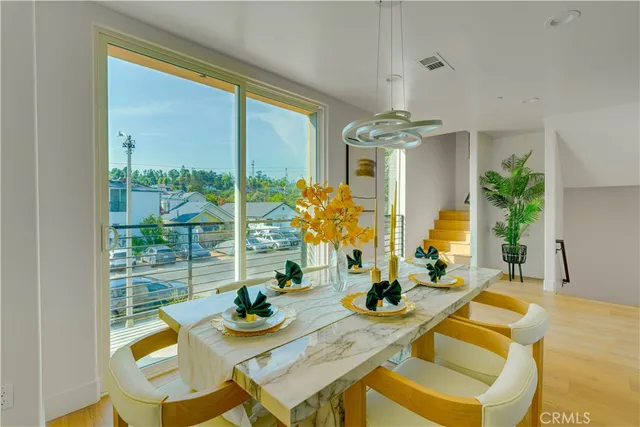 a kitchen that has a sink and a stove in it