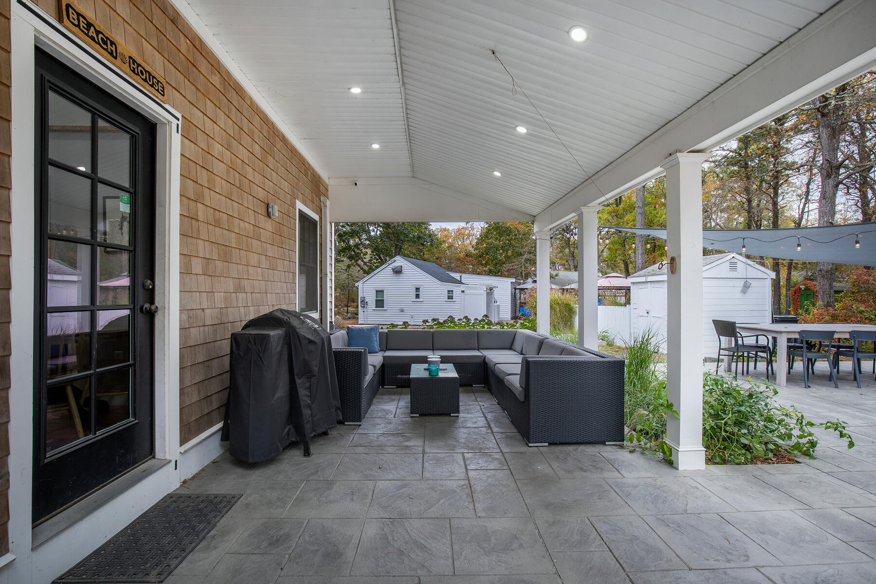 262 Old Wharf Road, Unit 87 Dennis Port, MA 02639 - Photo 11 of 39 a living room with furniture and large windows