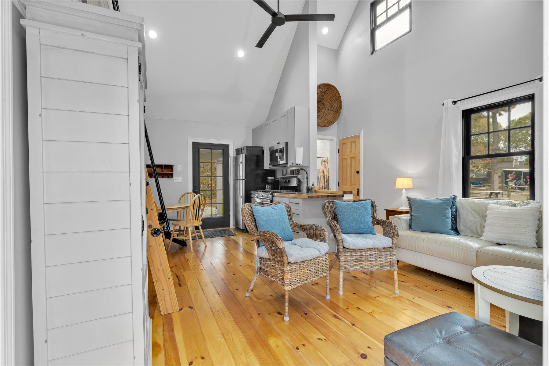 262 Old Wharf Road, Unit 87 Dennis Port, MA 02639 - Photo 12 of 39 a living room with fireplace furniture and a large window