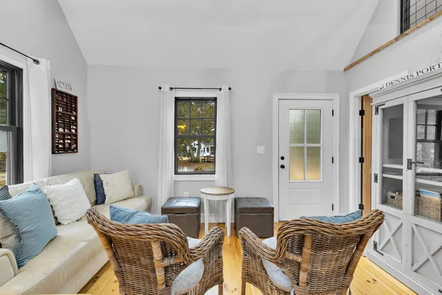 a living room with furniture and windows