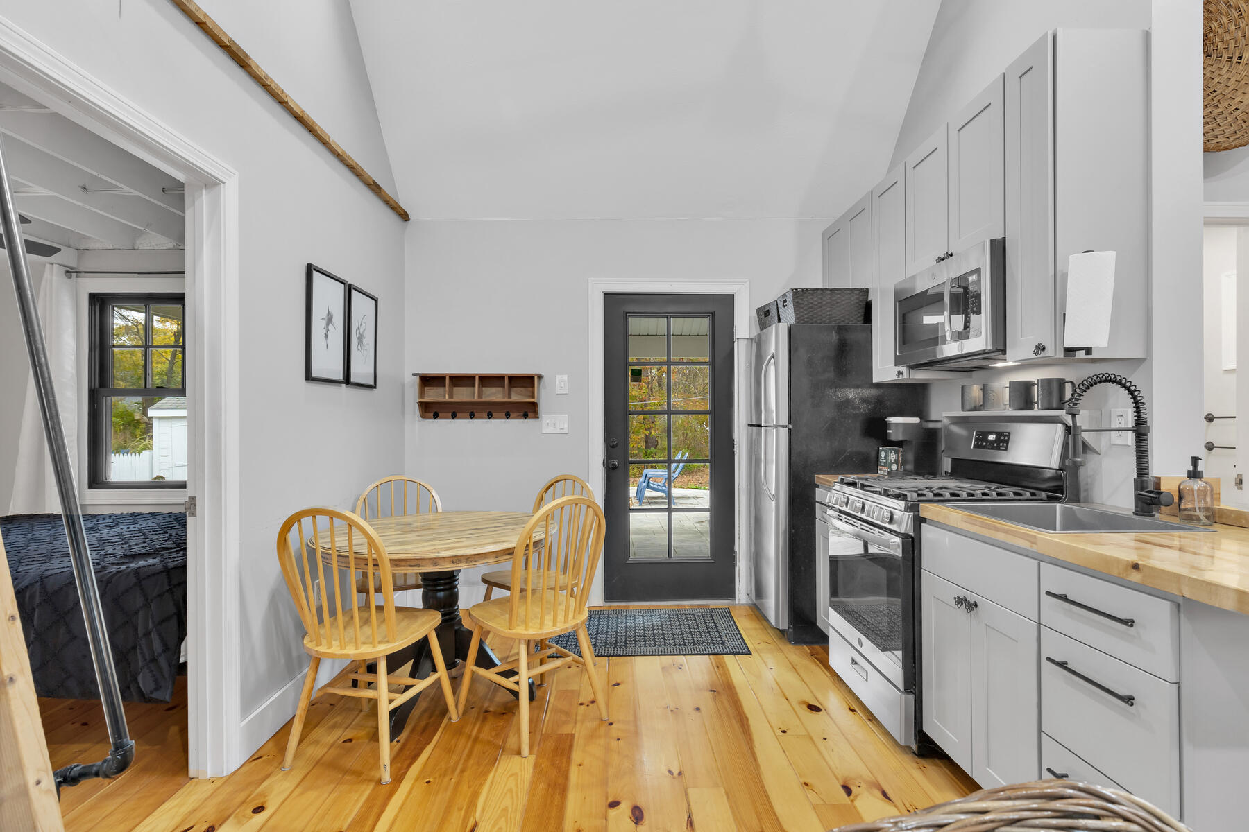 262 Old Wharf Road, Unit 87 Dennis Port, MA 02639 - Photo 15 of 39 a view of a dining room with furniture and wooden floor