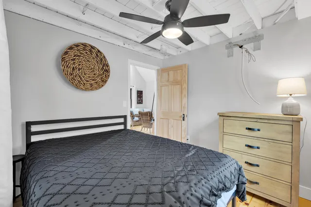 a bedroom with a bed and a cabinets