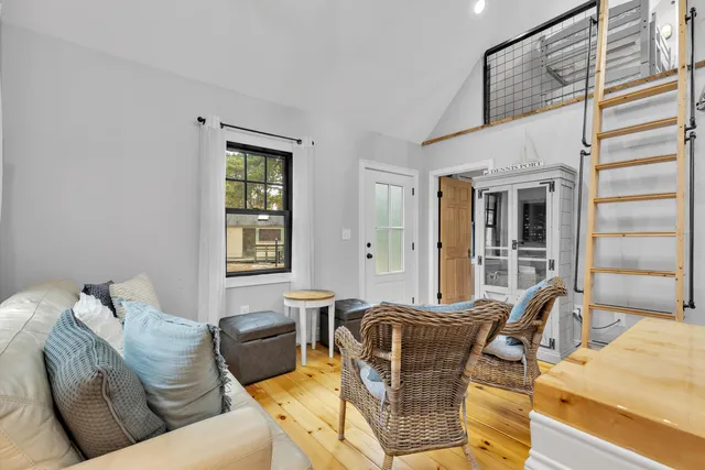 a living room with furniture and windows