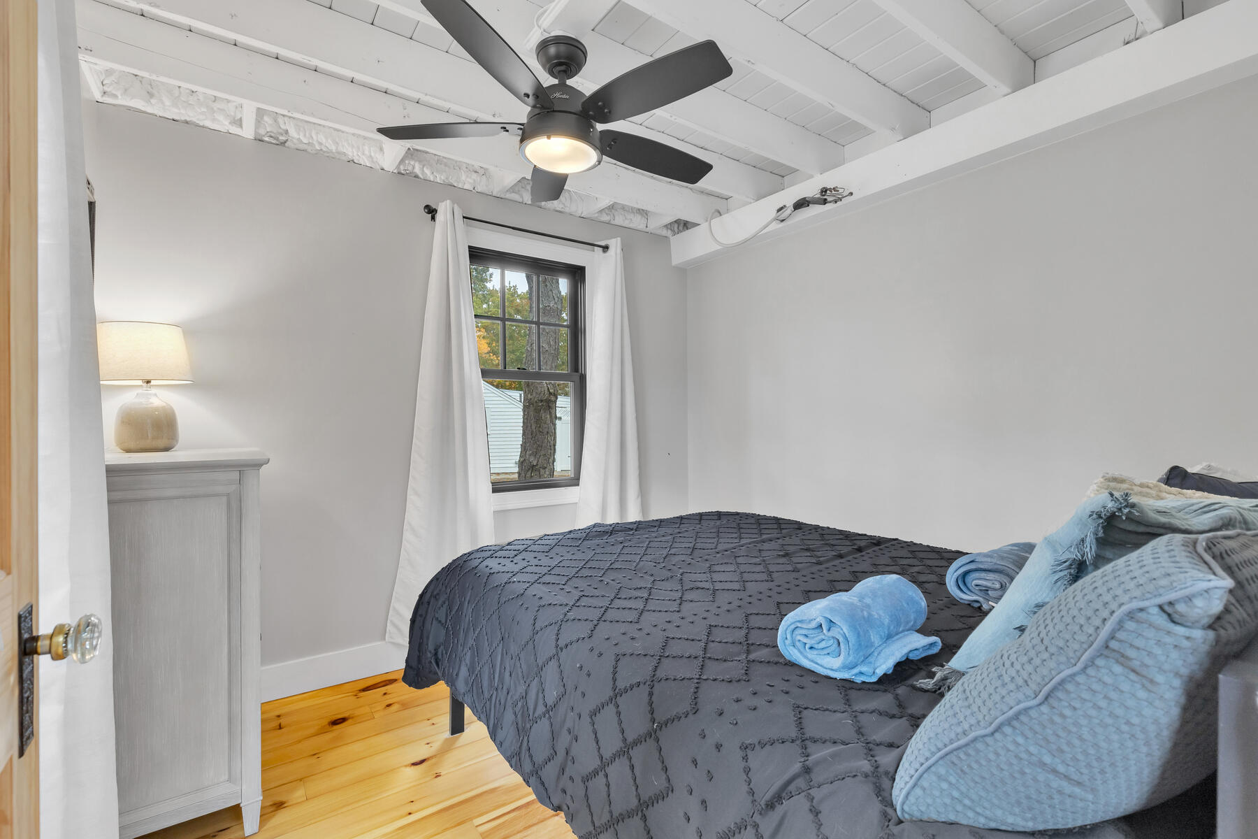 262 Old Wharf Road, Unit 87 Dennis Port, MA 02639 - Photo 21 of 39 a bedroom with a bed and a window