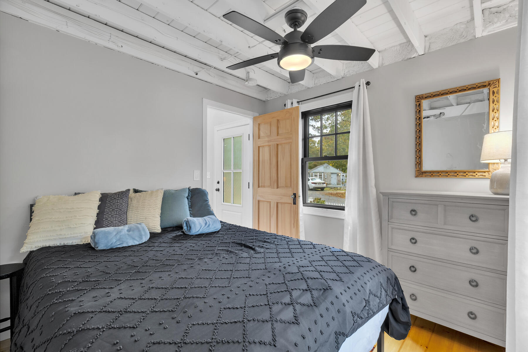 262 Old Wharf Road, Unit 87 Dennis Port, MA 02639 - Photo 22 of 39 a bedroom with a large bed and a window