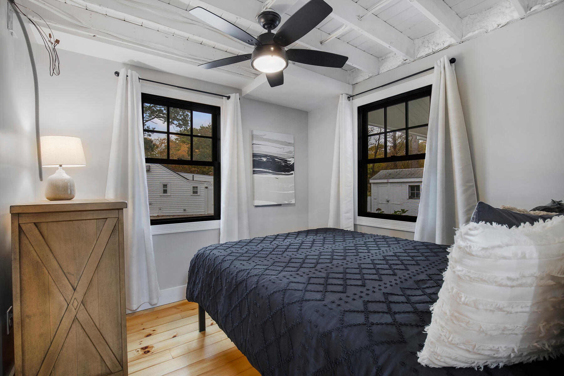262 Old Wharf Road, Unit 87 Dennis Port, MA 02639 - Photo 26 of 39 a bedroom with a bed and a dresser