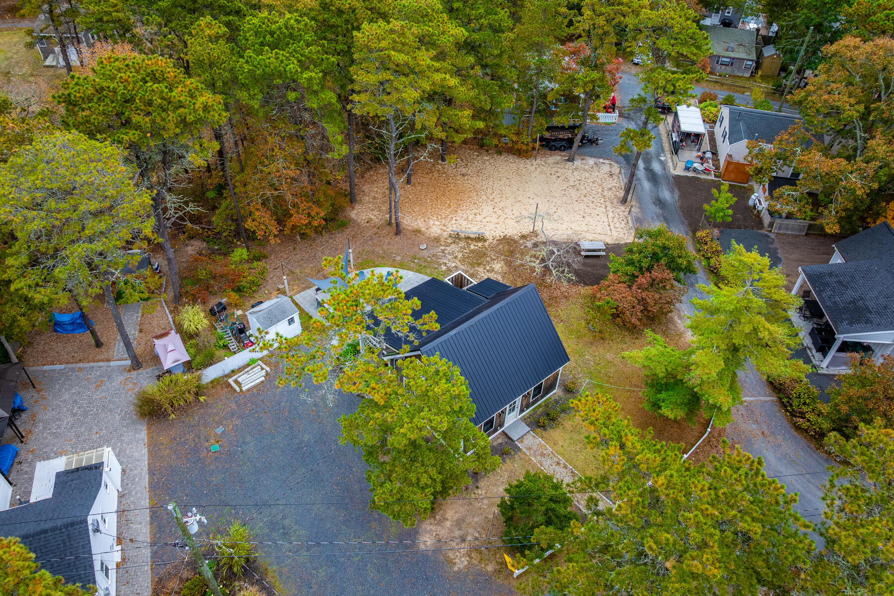 262 Old Wharf Road, Unit 87 Dennis Port, MA 02639 - Photo 32 of 39 an aerial view of a house with a yard basket ball court and outdoor seating