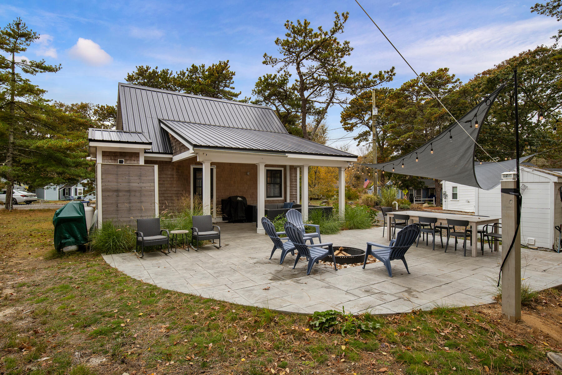 262 Old Wharf Road, Unit 87 Dennis Port, MA 02639 - Photo 5 of 39 a view of a house with backyard and sitting area