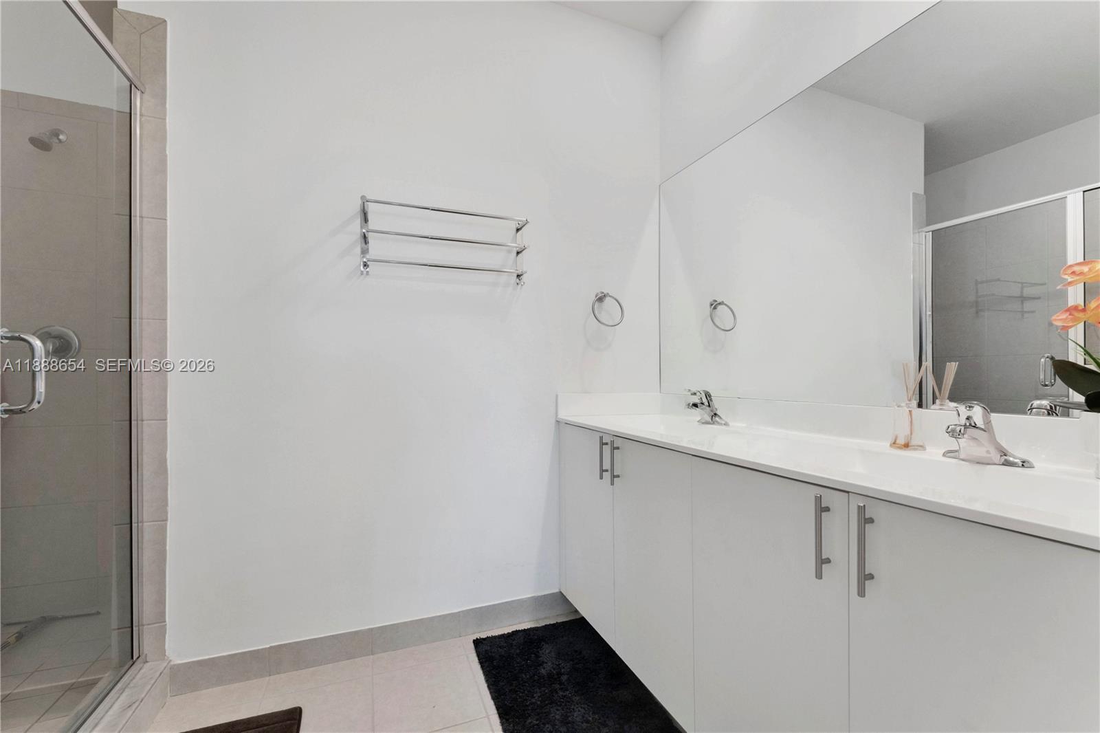 23512 Southwest 129th Path Homestead, FL 33032 - Photo 15 of 39 a bathroom with a sink and mirror