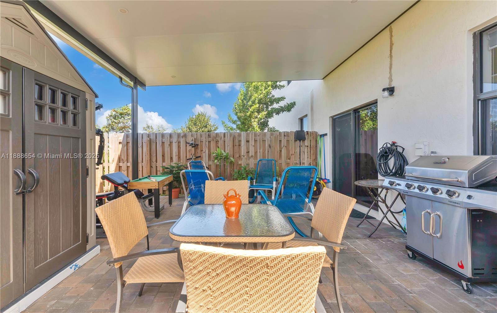 23512 Southwest 129th Path Homestead, FL 33032 - Photo 21 of 38 Covered patio with brick pavers