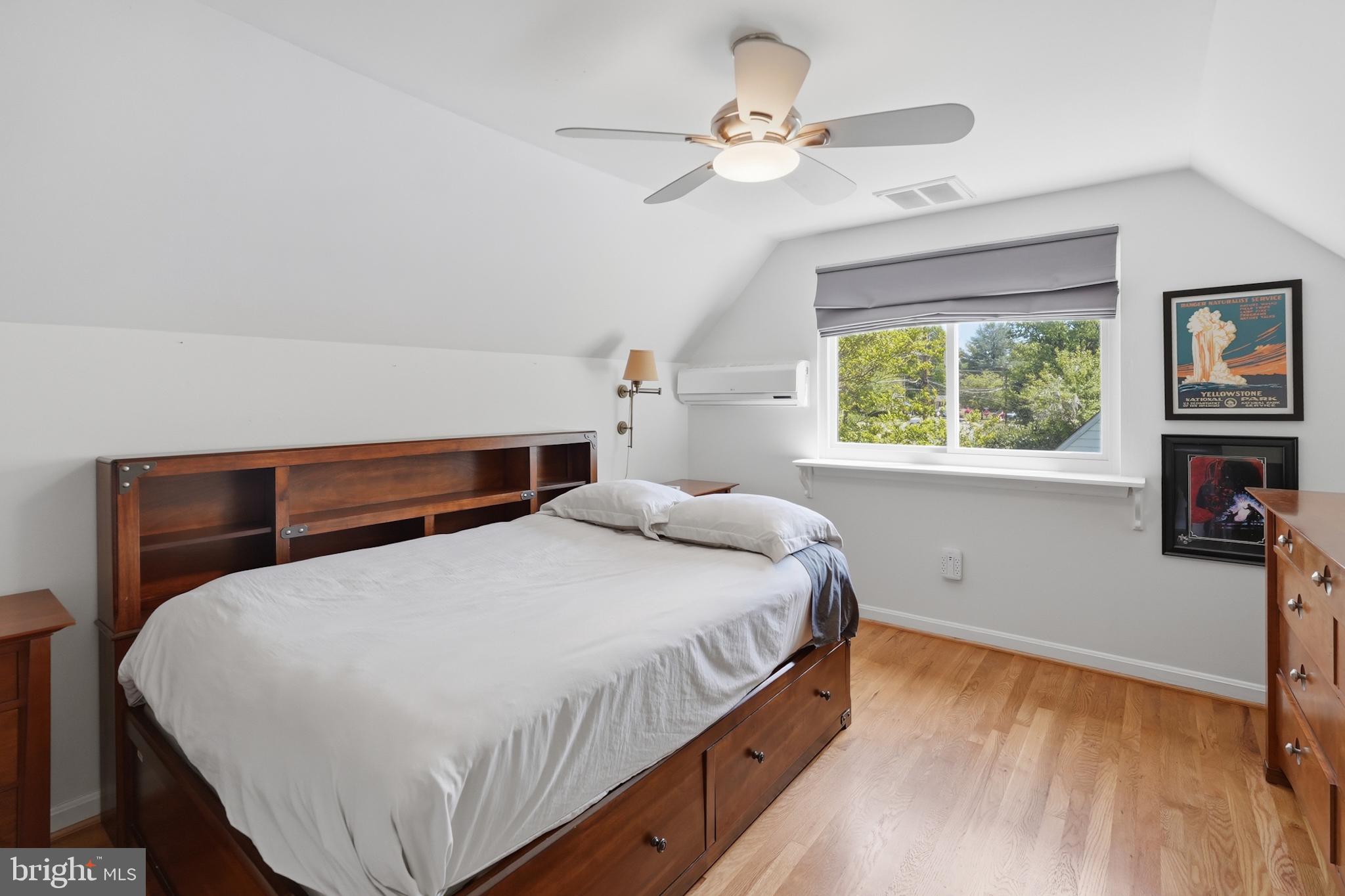 7006 Barnack Drive Springfield, VA 22152 - Photo 34 of 56 a bedroom with a bed and a chandelier