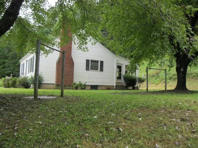 73 Highland Farm Road Callaway, VA 24067 - Photo 4 of 17 a house view with garden space and trees