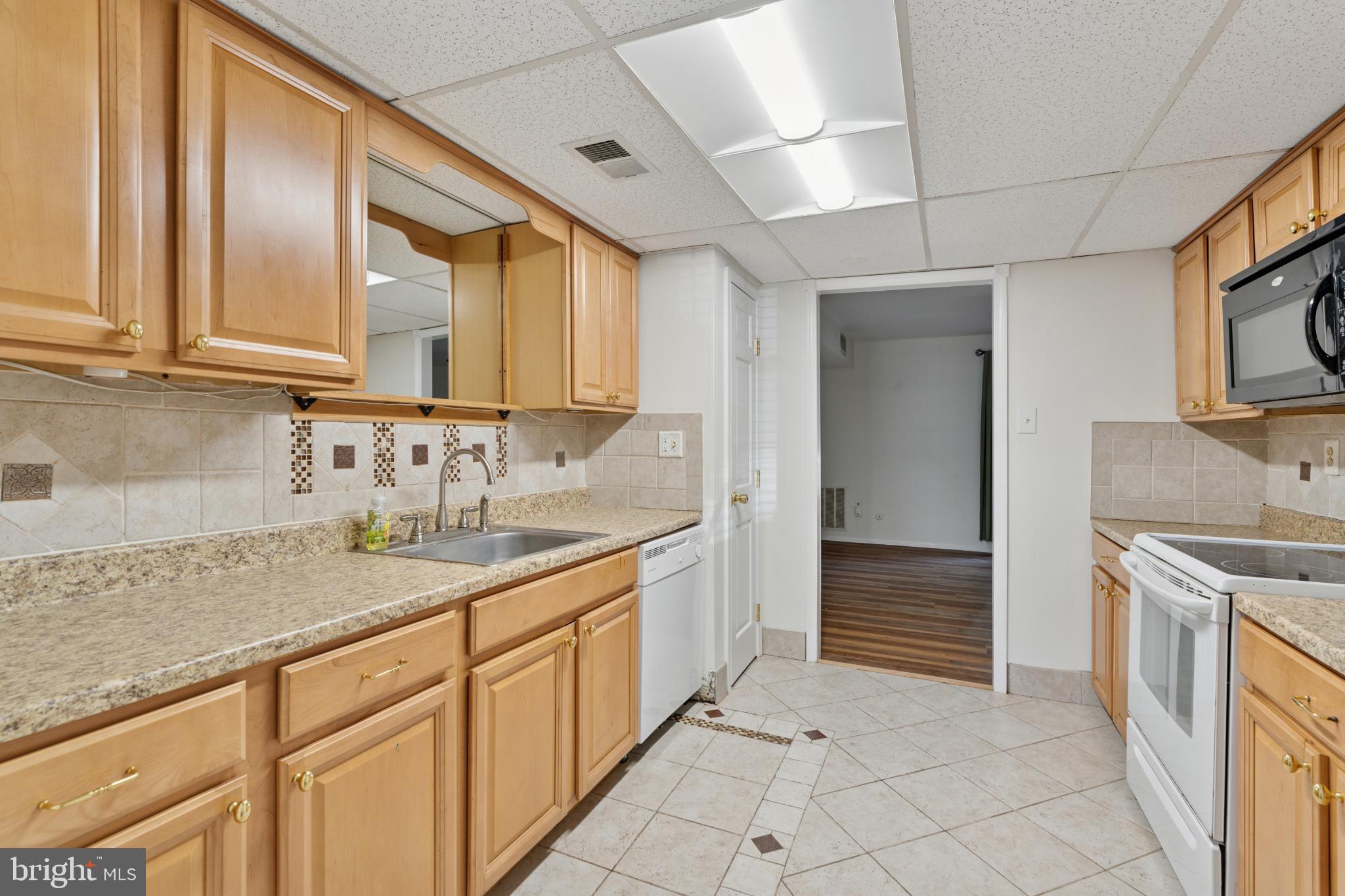 17 Providence Avenue Doylestown, PA 18901 - Photo 7 of 25 Charming kitchen with warm wood cabinetry.