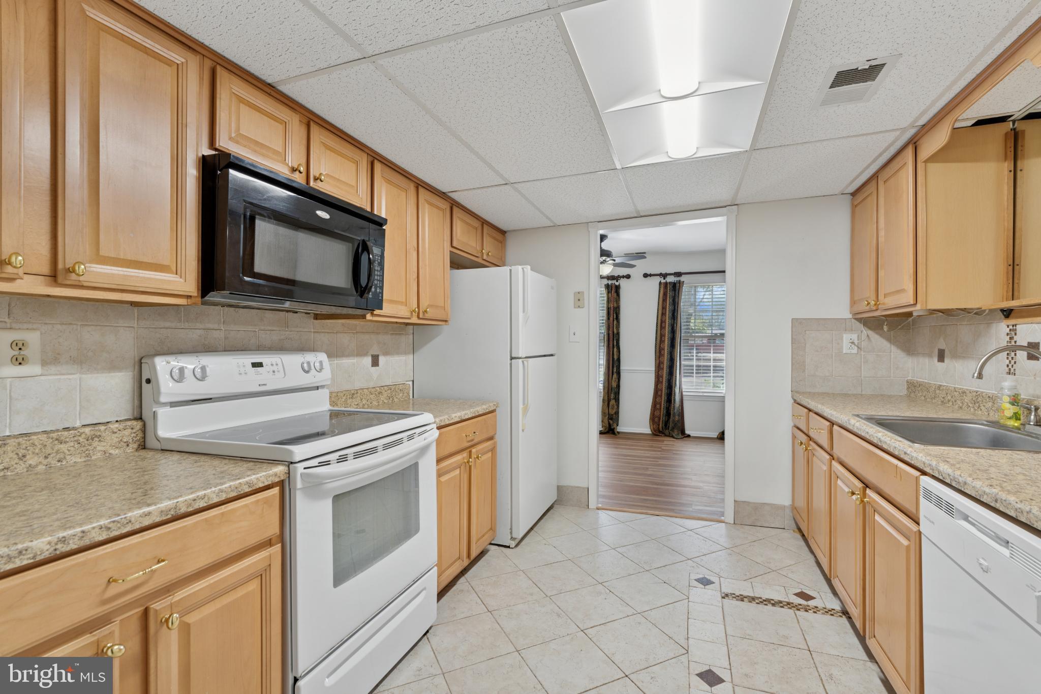 17 Providence Avenue Doylestown, PA 18901 - Photo 8 of 25 Modern kitchen with warm wood cabinetry.