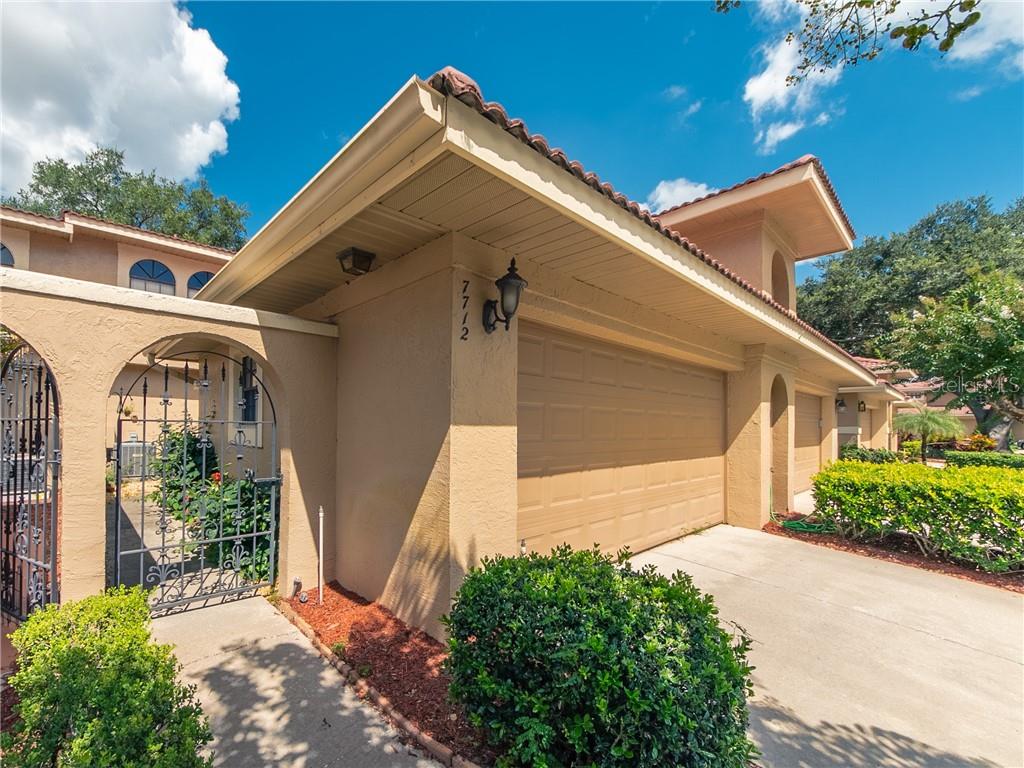 7712 Windbreak Road Orlando, FL 32819 - Photo 1 of 1 a front view of a house with garden