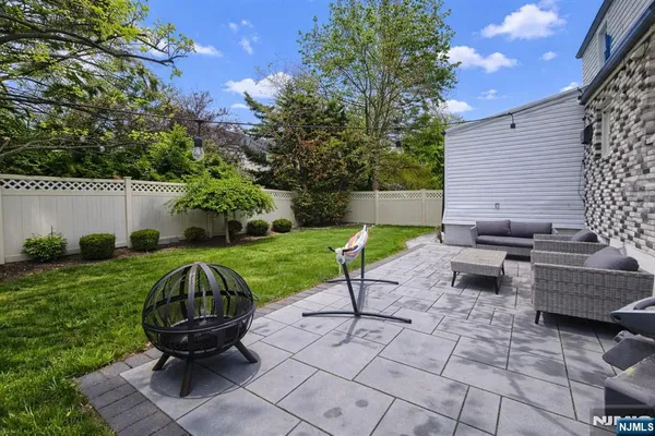 a view of backyard with patio