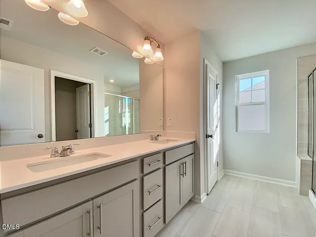 a bathroom with a sink a toilet and a bathtub