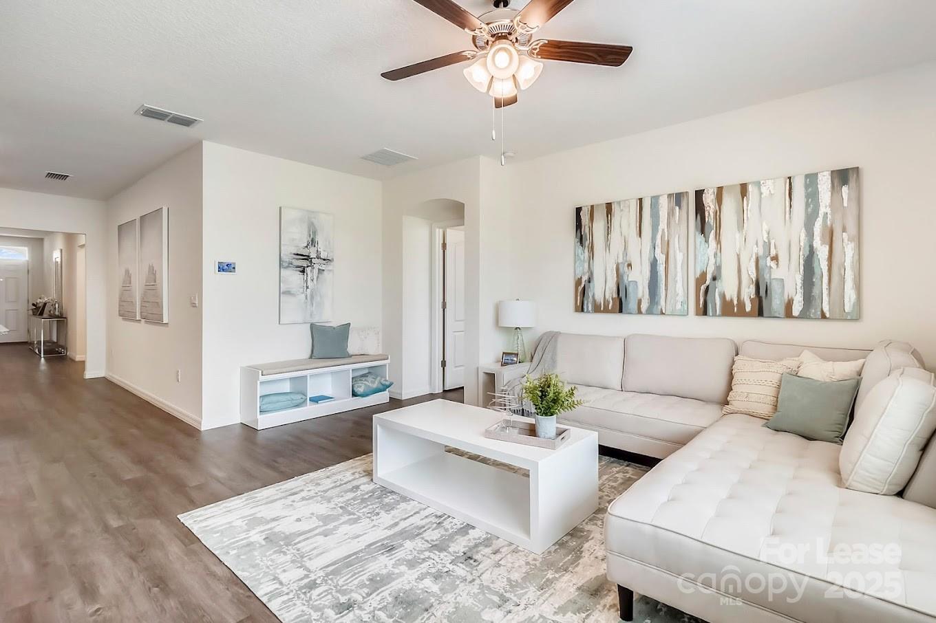 111 Switchgrass Loop, Unit ARIA Fairview, NC 28730 - Photo 14 of 20 a living room with furniture and a wooden floor