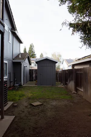 a view of a yard in front of a house