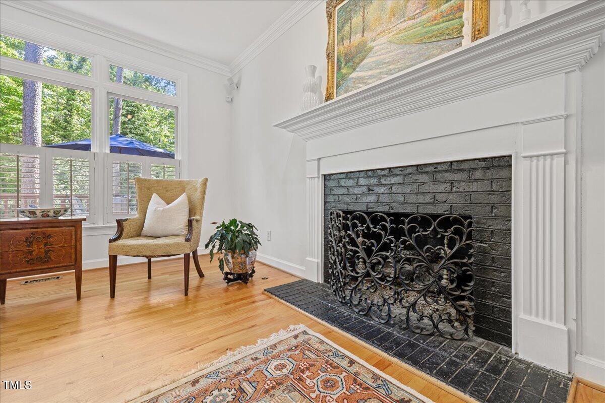 8604 Stanton Place Raleigh, NC 27615 - Photo 12 of 54 a living room with a couch and a fireplace