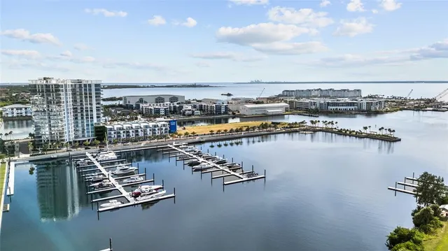 a view of a lake with a table and chairs