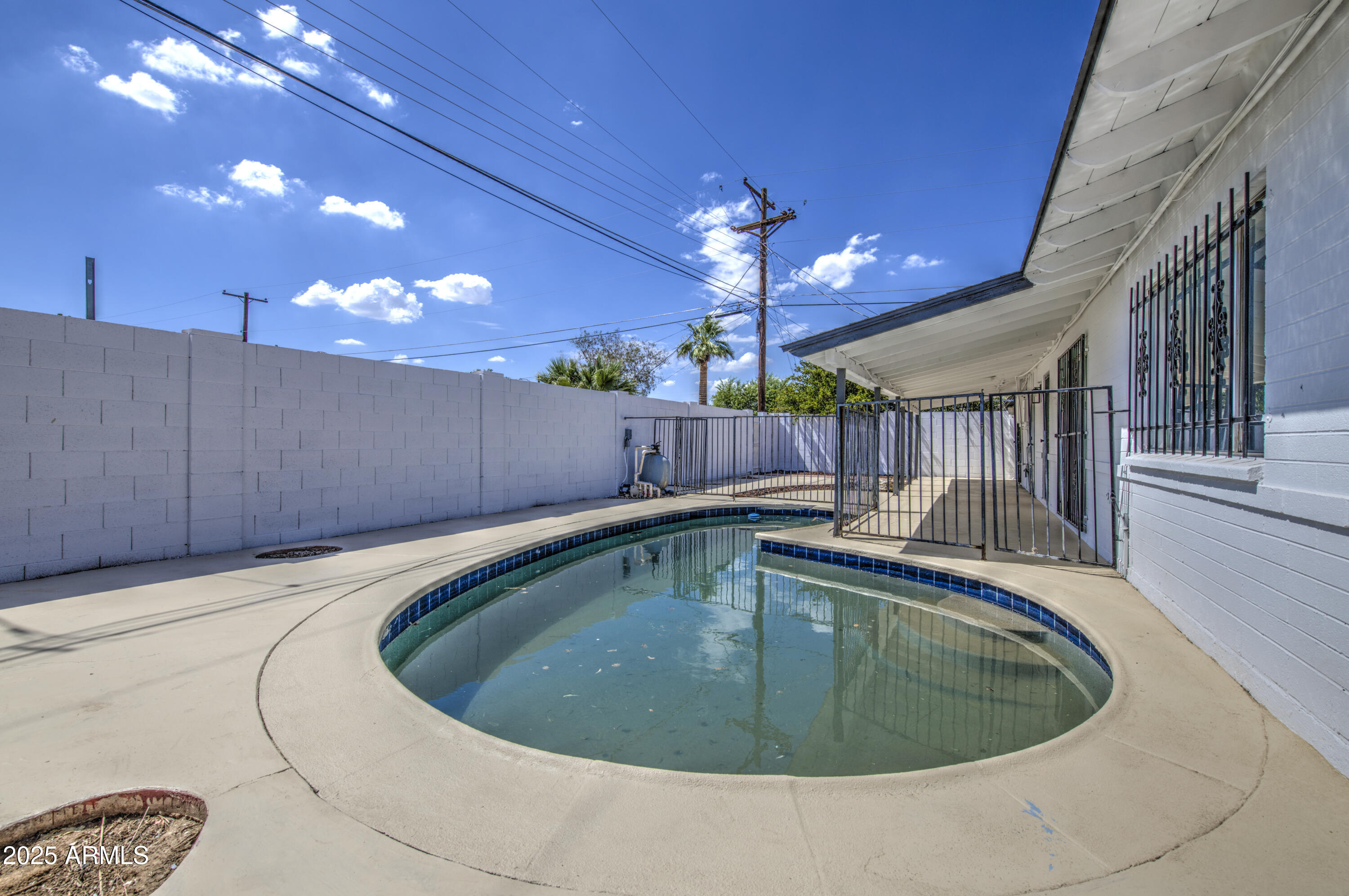 4750 North 39th Drive Phoenix, AZ 85019 - Photo 37 of 39 a view of a swimming pool with a seating space