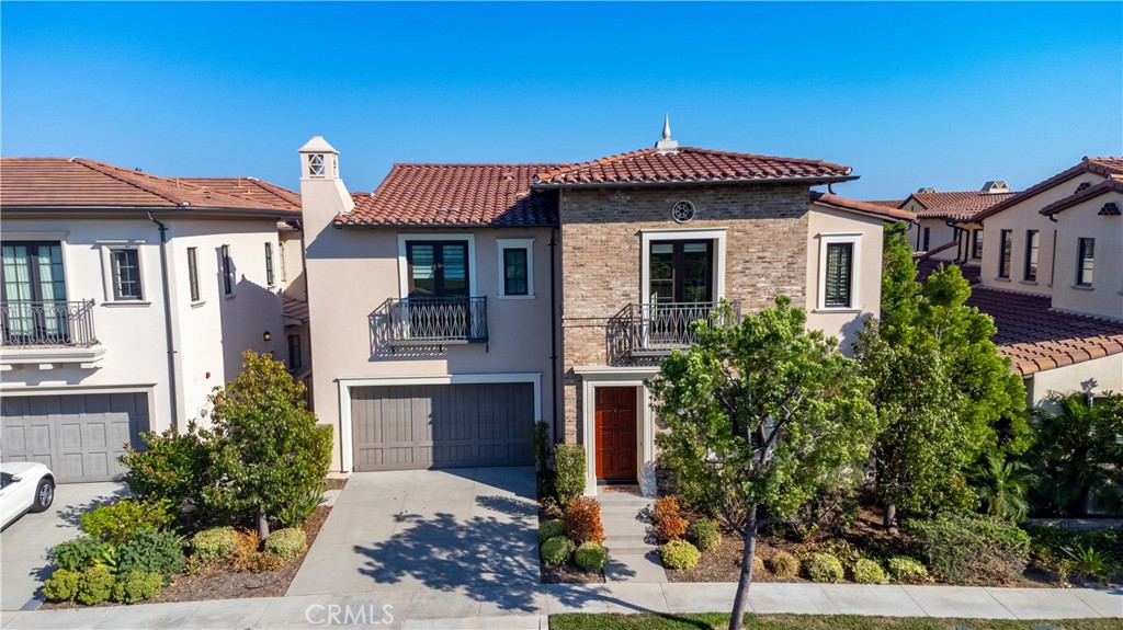 106 Quiet Place Irvine, CA 92602 - Photo 1 of 1 a front view of a house with a yard