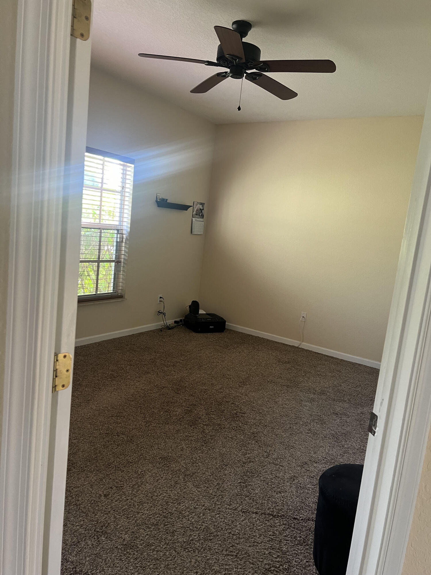 944 Southeast Browning Avenue Port St. Lucie, FL 34983 - Photo 14 of 18 an empty room with windows