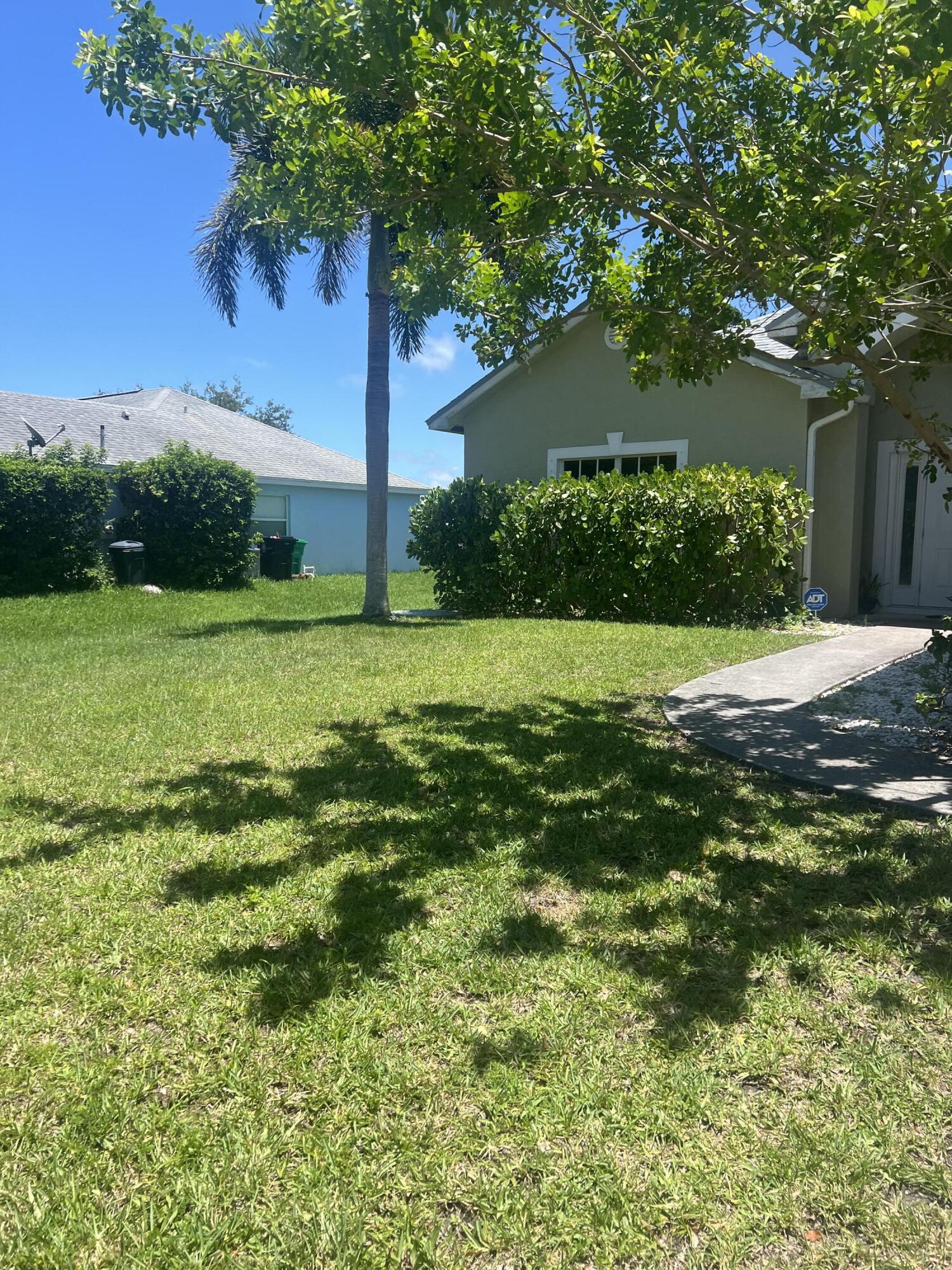 944 Southeast Browning Avenue Port St. Lucie, FL 34983 - Photo 2 of 18 a view of a trees with a yard